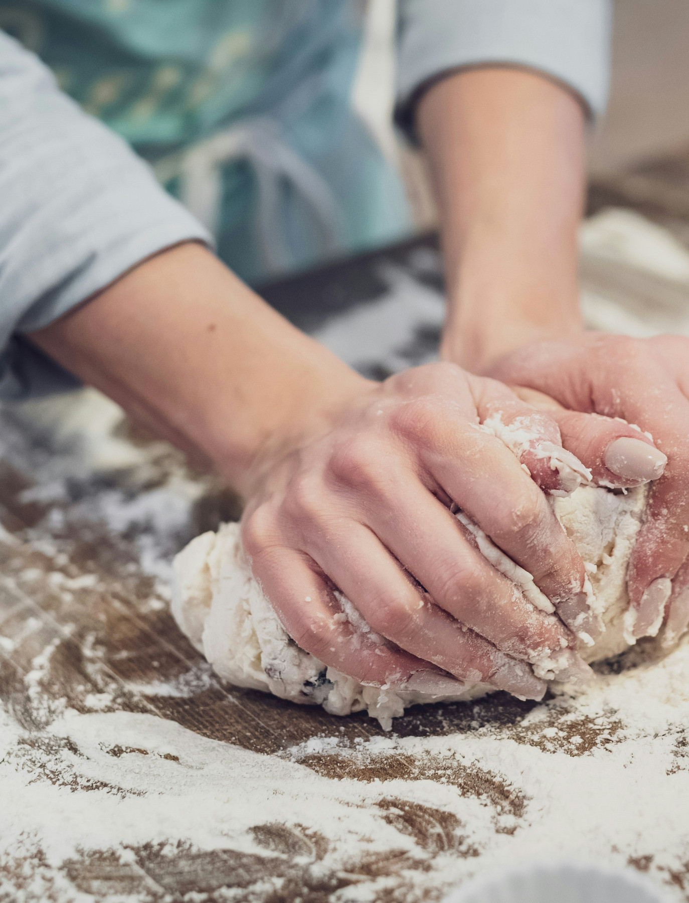 Hands working bread dough